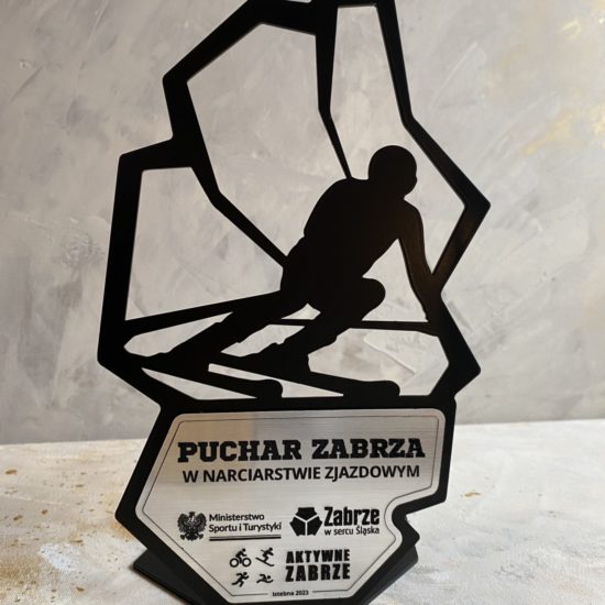 Metalowa statuetka narciarska wraz z personalizowaną tabliczką - granice miasta Zabrze i narciarz.